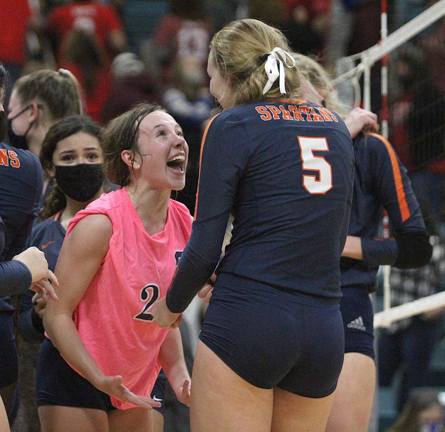 Seven Lakes senior Kailey Bickel, left, and junior Casey Batenhorst celebrate during the Spartans' 3-1 win over district rival Katy High in their Class 6A Region III final on Friday, Dec. 4, at the Merrell Center.